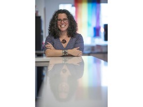 Tia Agnew, co-founder and CEO of New Day Craft, an Indianapolis-based producer of mead and cider, poses in the tasting room in Indianapolis, Monday, July 30, 2018. Agnew said she was excited to put up her "Open to All" window sticker, which she says matches her "personal and professional ethos." She's not worried that it will be a turn-off to some potential patrons.