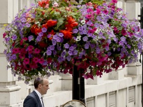 Britain's new Secretary of State for Exiting the European Union Dominic Raab leaves 10 Downing Street after it was announced he was appointed to the job in London, Monday, July 9, 2018. Former Housing Minister Dominic Raab is to take up the post, after U.K. Brexit Secretary David Davis resigned from the Cabinet and said Monday that he won't seek to challenge Prime Minister Theresa May's leadership.
