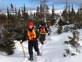 Geophysical crew delineating drill targets.