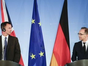 German Foreign Minister Heiko Maas, right, and his counterpart from Britain Jeremy Hunt, left, brief the media after a meeting at the foreign ministry in Berlin, Germany, Monday, July 23, 2018.
