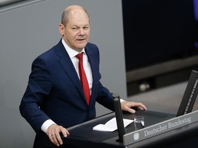 German Finance Minister Olaf Scholz delivers a speech during a budget debate at the German parliament, Bundestag, at the Reichstag building in Berlin, Germany, Tuesday, July 3, 2018.
