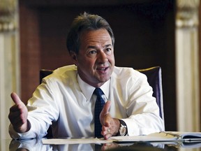 FILE - This July 16, 2018 file photo shows Montana Gov. Steve Bullock at the Capitol in Helena, Mont. Bullock and the state Department of Revenue are suing the Internal Revenue Service and the U.S. Department of the Treasury over a decision last week to end the requirement that some tax-exempt groups disclose the identities of their major donors.