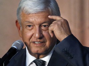 Mexico's President-elect Andres Manuel Lopez Obrador speaks to reporters after meeting with Mexico's President Enrique Pena Nieto at the National Palace in Mexico City, Tuesday, July 3, 2018. The president-elect met with the current leader to discuss his transition to office in December, aiming to ensure an orderly transfer of power after a heated and polarizing campaign.