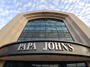 FILE - This July 17, 2018, file photo, shows the corporate headquarters of Papa John's pizza located on their campus, in Louisville, Ky. Papa John's  is adopting a shareholder rights plan as it looks to safeguard against its disgraced founder possibly attempting to take control of the pizza chain.