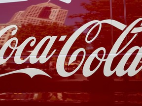 FILE - This April 24, 2017, photo shows a Coca-Cola delivery van in downtown Pittsburgh. Coca-Cola is reporting strong profit and revenue numbers, thanks in part to rising demand for Diet Coke and Coca-Cola Zero Sugar in North America. The Atlanta company on Wednesday, July 25, 2018, posted second-quarter profit of $2.32 billion, or 54 cents per share.