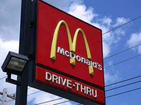 FILE - This July 18, 2018, file photo, shows a sign outside a McDonald's restaurant in Pittsburgh.  McDonald's Corp. (MCD) on Thursday, July 26, reported second-quarter net income of $1.5 billion.