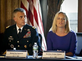 Secretary of Homeland Security Kirstjen Nielsen, right, and U.S. officials including National Security Agency General Paul Nakasone hold a meeting with CEO's at the Department of Homeland Security (DHS) National Cybersecurity Summit, Tuesday, July 31, 2018, in New York.