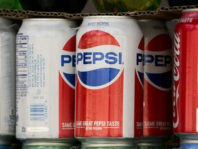 FILE- In this May 7, 2018, file photo, cans of Pepsi are displayed in New York. PepsiCo Inc. reports earns on Tuesday, July 10.