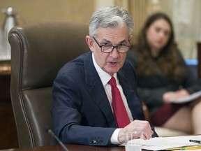 FILE- In this June 14, 2018, file photo, Federal Reserve Board Chairman Jerome Powell chairs an open meeting in Washington. On Thursday, July 5, the Federal Reserve releases minutes from its June meeting when raised its benchmark interest rate for the second time this year.
