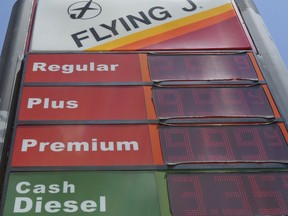 FILE- This June 14, 2018, file photo shows signage and gas prices for regular and diesel at Flying J along Interstate 85 and 40 near Graham, N.C. On Thursday, July 12, the Labor Department reports on U.S. consumer prices for June.