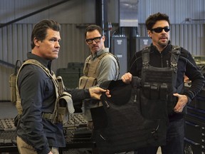 This image released by Sony Pictures shows Josh Brolin, from left, Jeffrey Donovan and Benicio Del Toro in "Sicario: Day of the Soldado."