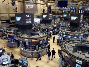 FILE- In this Feb. 9, 2017, file photo, traders work the floor at the New York Stock Exchange. The U.S. stock market opens at 9:30 a.m. EDT on Wednesday, July 18, 2018.