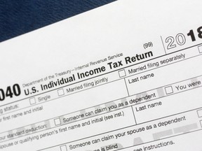 A portion of the 1040 U.S. Individual Income Tax Return form for 2018 is displayed, Tuesday, July 24, 2018, in New York. The $1.5-trillion tax overhaul includes the end of a 75-year-old deduction on alimony payments.