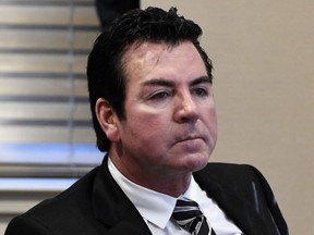 FILE - In this Wednesday, Oct. 18, 2017, file photo, Papa John's founder and CEO John Schnatter attends a meeting in Louisville, Ky. Schnatter is apologizing after reportedly using a racial slur during a conference call in May 2018. The apology Wednesday, July 11, 2018, comes after Forbes cited an anonymous source saying the pizza chain's marketing firm broke ties with the company afterward.