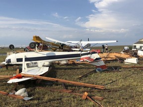 This Sunday, July 29, 2018, photo provided by Colorado Sen. Cory Gardner shows damage from a storm just after it hit the area near Brush, Colo. People on the plains of northeastern Colorado were cleaning up Monday from a powerful storm that swept through the state, ripping off roofs, flipping trucks and damaging crops. No serious injuries were reported.