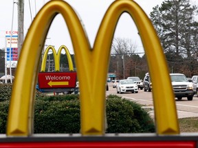 FILE - This Feb. 15, 2018, file photo shows a McDonald's Restaurant in Brandon, Miss. Seven national fast-food chains have agreed to end policies that block workers from changing branches, limiting their wages and job opportunities, under the threat of legal action from the state of Washington. Washington Attorney General Bob Ferguson announced the binding agreements with companies including Arby's, Jimmy John's and Cinnabon, at a news conference Thursday, July 12, 2018. McDonald's also signed on, but previously announced plans to end the practice.
