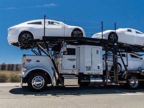 Tesla Inc. vehicles are transported on a truck after leaving the company's manufacturing facility in Fremont, California. Tesla pulled out all the stops in the final week of June to meet its goal of making 5,000 Model 3s in a week, workers said.