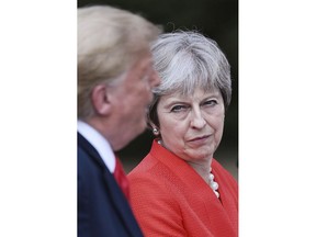 British Prime Minister Theresa May and U.S President Donald Trump hold a joint press conference at Chequers, in Buckinghamshire, England, Friday, July 13, 2018.