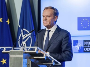 FILE - In this July 10, 2018, file photo, European Council President Donald Tusk addresses the media after the signature of the second EU NATO Joint Declaration, in Brussels. The senior European Union official on Monday, July 16, 2018,  urged President Donald Trump, Russian President Vladimir Putin and China to work with Europe to avoid trade wars and prevent conflict and chaos. Tusk was speaking in Beijing at the opening of a summit between China and the European Union, just hours ahead of a summit between Trump and Putin in Helsinki.