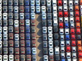 In this January 2017 photo, cars are parked waiting to be exported at Yokohama port near Tokyo. Japan's government has warned in a report that a higher U.S. tariff on auto imports could backfire, jeopardizing hundreds of thousands of American jobs created by Japanese auto-related companies, raising prices for U.S. consumers and devastating the U.S. and global economy. (Kyodo News via AP)