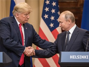 U.S. President Donald Trump and Russian President Vladimir Putin shake hands during a joint press conference after their summit on July 16, 2018 in Helsinki, Finland.