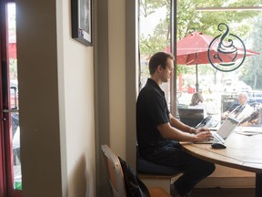 Tom Szold, Chief Executive Officer at Precision Safe Sidewalks, works from a coffee shop on Friday, July 27, 2018, in Alexandria, Va. Szold joined his brother and a longtime friend in May to buy Precision Safe Sidewalks, which helps city governments and other customers identify where their trip hazards are and how to fix them.