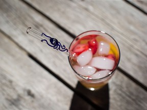 A glass straw is seen in a drink at Aimee Promislow and Fred Tischler's home where they operate their glass straw company, Glass Sipper, in Vancouver, on Wednesday July 11, 2018.