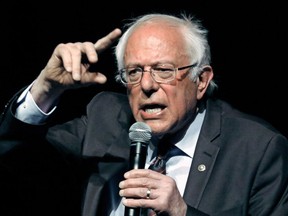 FILE - In this April 4, 2018, file photo, Sen. Bernie Sanders, I-Vt., responds to a question during a town hall meeting in Jackson, Miss. Sanders' "Medicare for all" plan would increase government health care spending by $32.6 trillion over 10 years, according to a study by a university-based libertarian policy center.