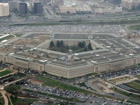 FILE - This March 27, 2008, file photo, shows the Pentagon in Washington. The House has approved a $716 billion defense policy bill that would give troops a 2.6 percent pay hike, the largest in nine years. The bill, which is the result of a deal struck with the Senate, also would allow the president to waive sanctions against countries that have bought Russian weapons but now want to buy U.S. military equipment. The Pentagon says the waiver would help countries such as India that are seeking to "pull away from the Russian orbit.'' The bill now goes to the Senate.