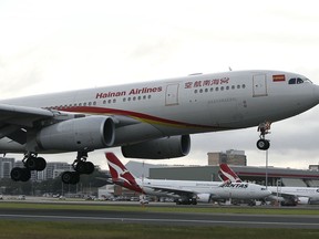 FILE - In this Sept. 13, 2016, file photo, Hainan Airlines' new service from Changsha to Sydney touches down for the first time at Sydney Airport in Australia. Chinese conglomerate HNA Group, which operates Hainan Airlines and other businesses around the world, said Wednesday, July 4, 2018, that its co-chairman has died while on a business trip in France.