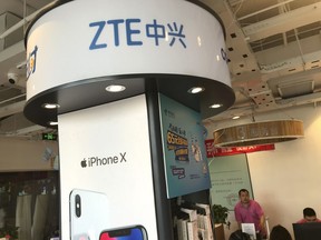 ZTE's logo is seen in a telecommunication services shop in Beijing Wednesday, July 4, 2018. Tech giant ZTE Corp.'s near-death experience after Washington barred it from buying U.S. components was a stark reminder that China's industry leaders cannot function without American technology.