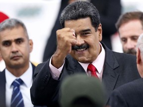 FILE - In this May 22, 2018 photo, Venezuela's President Nicolas Maduro greets guests after receiving from the National Electoral Council, CNE, a certificate declaring him the winner of the presidential election, during a ceremony at CNE headquarters in Caracas, Venezuela. Maduro has announced on Wednesday, July 25, a monetary reform that will remove 5 zeros from the value of the Venezuelan currency.