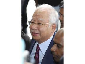 Former Malaysian Prime Minister Najib Razak, arrives at a court house in Kuala Lumpur, Malaysia, Wednesday, July 4, 2018.  Former Malaysian Prime Minister Najib has arrived at a Kuala Lumpur court house to face charges stemming from a corruption probe, two months after his shock election defeat.