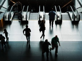 People exit a subway into a Manhattan shopping mall on June 28, 2018 in New York City. The American economy showed the weakest performance in consumer spending in nearly five years new numbers from the Commerce Department show.