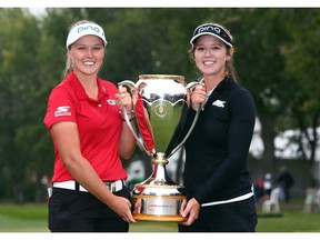 Skechers GO GOLF elite athlete Brooke Henderson (left) celebrates her CP Women's Open win with sister and caddy Brittany.