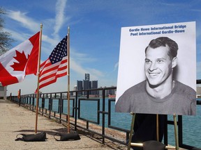 A photo of hockey great Gordie Howe was unveiled at the announcement that the Detroit River International Crossing will be named the Gordie Howe International Bridge, on the waterfront, in Windsor, Ont., Thursday May 14, 2015. Aecon Group Inc. says it has received approval to rejoin the group selected as the preferred proponent to build and operate the Gordie Howe International Bridge.