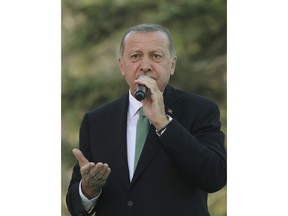 Turkey's President Recep Tayyip Erdogan addresses his supporters in Gumushane, Turkey, Friday, Aug. 10, 2018. (Presidential Press Service via AP, Pool)