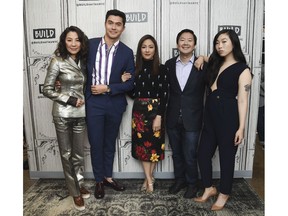 FILE: In this Aug. 14, 2018, file photo, Actors Michelle Yeoh, from left, Henry Golding, Constance Wu, Ken Jeong and Awkwafina participate in the BUILD Speaker Series to discuss the film "Crazy Rich Asians" at AOL Studios in New York. The craze for "Crazy Rich Asians" is hitting Asia, with a premiere in Singapore to be followed by openings in several neighboring countries later this week. Much of the movie was set in the wealthy city-state and the red carpet premiere Tuesday night for the over-the-top romantic comedy was expected to draw an enthusiastic crowd after its box-office bonanza in the U.S. Critics say its satirical portrayal of an uber-rich Singaporean Chinese family fails to showcase the city's ethnic diversity.