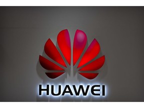 FILE - In this Wednesday, July 4, 2018, photo, the Huawei logo is seen at a Huawei store at a shopping mall in Beijing. Chinese-owned telecommunications giant Huawei has been blocked from rolling out Australia's 5G network due to security concerns.