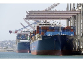 ADVANCE FOR USE FRIDAY, AUG. 31, 2018, AT 3:01 A.M. EDT AND THEREAFTER - In this Wednesday, Aug. 22, 2018, photo ships are docked at the Port of Long Beach in Long Beach, Calif. Between them, the California ports of Los Angeles and Long Beach account for a large amount of the seaborne goods that the United States imports from China, and the prospect of a widening trade war between the global giants has port executives and longshoremen worried.
