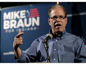 FILE - This May 8, 2018, file photo Republican Senate candidate Mike Braun thanks supporters after winning the republican primary in Whitestown, Ind. One of the chief suppliers for a line of trademarked auto parts sold by Indiana Senate candidate Mike Braun laid off more than 200 American workers and shipped their jobs to Asia. Braun has ignored outsourcing questions. Instead, he attacks his rival, Democratic Sen. Joe Donnelly, for once owning stock in a family business that has a factory in Mexico.