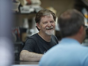 FILE - In this June 4, 2018 file photo, baker Jack Phillips, owner of Masterpiece Cakeshop, manages his shop after a U.S. Supreme Court issued a limited ruling in his favor after he refused to make a wedding cake for a same-sex couple. He is suing Colorado after officials ruled against him in another alleged discrimination case in which his shop refused to make a cake celebrating a gender transition.