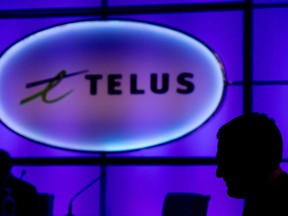 A Telus logo is seen before the telecom company's annual general meeting in Vancouver, B.C., on Thursday May 8, 2014. Telus Communications filed an application last week with the Canadian Radio-television and Telecommunications Commission, calling for a public review of what it deems as excessive cellphone traffic directed toward Iristel. Telus accuses Iristel of padding its bottom line, at the expense of Telus, by redirecting calls to the North where it can charge much higher call interconnection rates than in the rest of the country.THE CANADIAN PRESS/Darryl Dyck