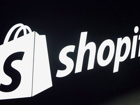 A Shopify logo is seen during an event in Toronto on Tuesday, May 8, 2018. Shopify is banning the sale of some firearms and their related parts through its platform. A policy update that the Ottawa-based ecommerce giant quietly posted Monday shows Shopify merchants can no longer use the platform to sell automatic firearms that have not been rendered inoperable and semi-automatic firearms that have the capacity to accept a detachable magazine.