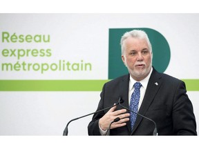 Quebec Premier Philippe Couillard speaks during a news conference in Montreal, Thusday, February 8, 2018, where he announced details of new automated light rail system for the Montreal region. A nascent federal agency designed to find new ways to finance construction of transit systems is making its first investment in a multi-billion-dollar electric rail system in Montreal.