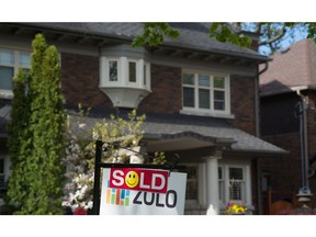 A sold sign is shown in front of west-end Toronto home.
