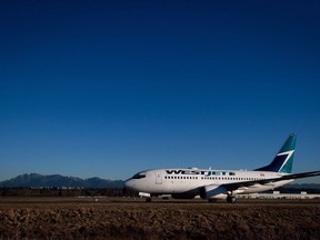 A Westjet Boeing 737-700 taxis to a gate after arriving at Vancouver International Airport in Richmond, B.C., on February 3, 2014.