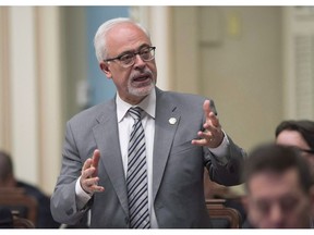 Quebec Finance Minister Carlos Leitao responds to the Opposition during question period, Tuesday, June 12, 2018 at the legislature in Quebec City. Leitao says protectionist measures of the Trump administration are already being felt on the ground in the province.