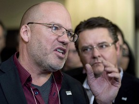 Quebec's labour movement is gearing up ahead of the October election as it faces the prospect of another four years with limited influence in the provincial government. SCFP union member Marc Ranger reacts to comments made by Coalition Avenir Quebec leader Francois Legault who spoke about unions in his speech to members of Quebec Municipalities Union (UMQ), in Quebec City on Friday, March 21, 2014.