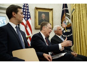 White House senior adviser Jared Kushner, left, and Vice President Mike Pence, right, listen as United States Trade Representative Robert Lighthizer talks with President Donald Trump about a trade "understanding" between the United States and Mexico, in the Oval Office of the White House, Monday, Aug. 27, 2018, in Washington.